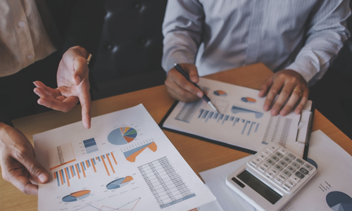 CFO and inventory planners reviewing costs